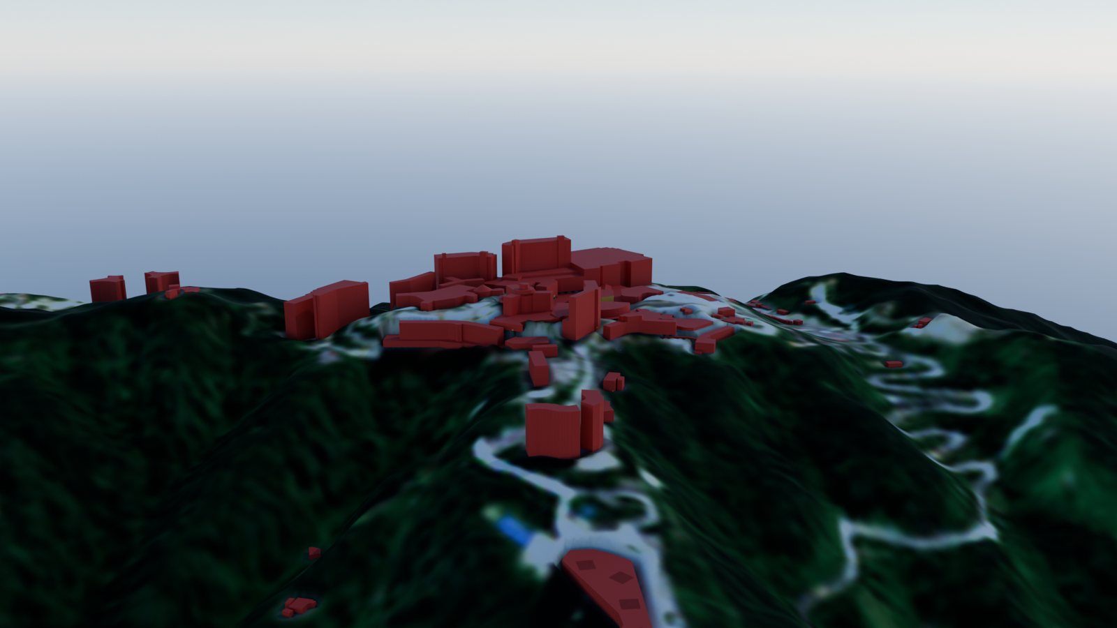 The same aerial view with buildings coloured by evidence class, almost entirely red for assumed